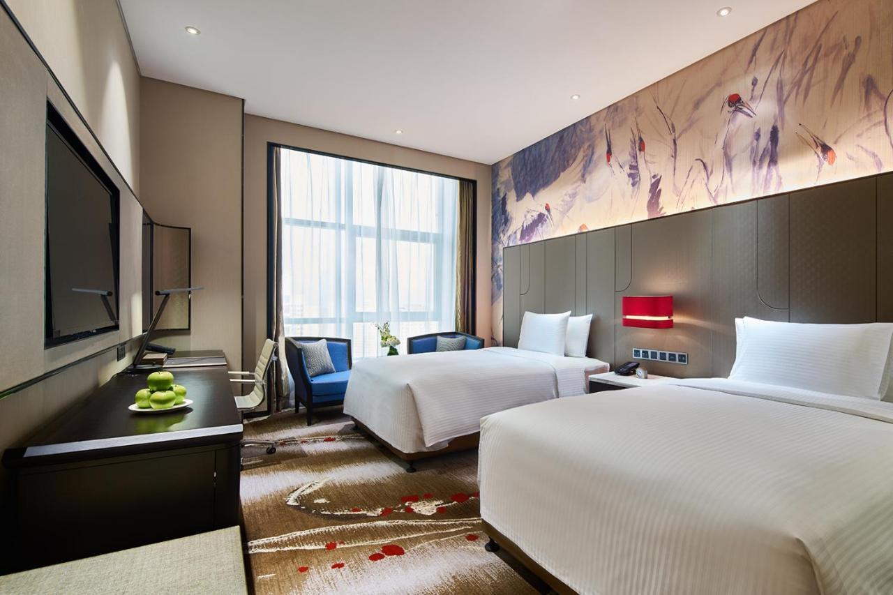 Wanda Realm Qiqihar Hotel Bagian luar foto
