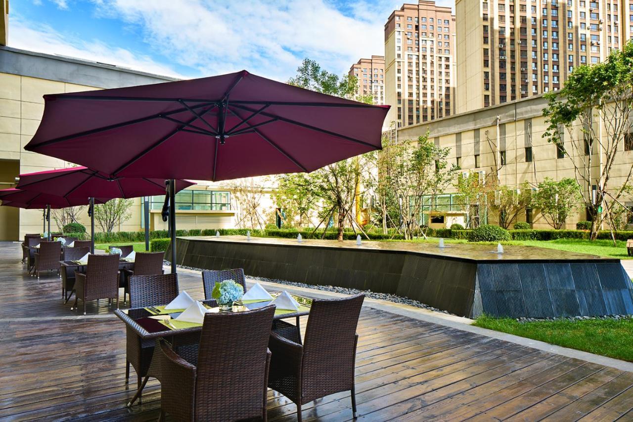 Wanda Realm Qiqihar Hotel Bagian luar foto